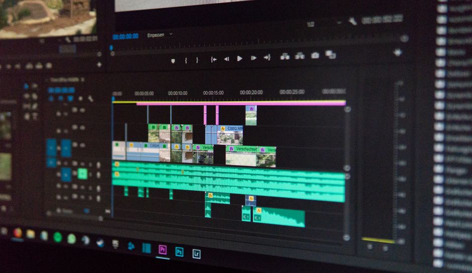 A video editing timeline on a computer screen, with video clips and audio waveforms on several tracks
